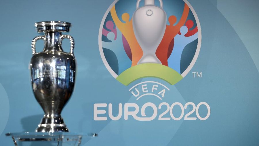 The Euro 2020 logo is pictured behind the trophy during the presentation of Munich's logo as one of the host cities of the Euro 2020 European soccer championships in Munich, Germany, Thursday, Oct. 27, 2016. (AP Photo/Matthias Schrader)
