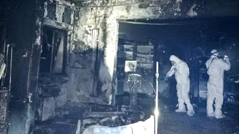 A burned bed from the destroyed COVID-19 intensive care ward at the hospital in Piatra Neamt, northern Romania, Saturday, Nov. 14, 2020, is placed in a corridor after a fire. Romanian officials say a fire at a hospital treating COVID-19 patients has killed 10 people and critically injured seven others as a blaze spread through the intensive care ward designated for people with COVID-19 patients at the public hospital according to the Emergency Situations Inspectorate.(Exploziv TV Neamt via AP)