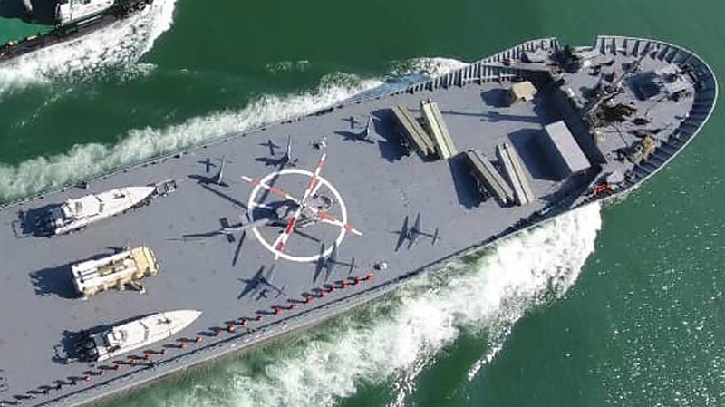 In this photo released Thursday, Nov. 19, 2020, by the Iranian Revolutionary Guard, the Guard's warship named after slain Guard naval commander Abdollah Roudaki, sails in to the Iranian southern territorial waters. Iran's paramilitary Revolutionary Guard said it launched a heavy warship Thursday capable of carrying helicopters, drones and missile launchers amid ongoing tensions with the U.S. (Sepahnews via AP)