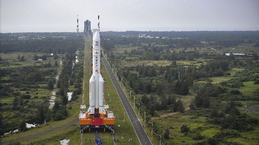 FILE - In this July 17, 2020, photo released by China's Xinhua News Agency, a Long March-5 rocket is seen at the Wenchang Space Launch Center in southern China's Hainan Province. Chinese technicians were making final preparations Monday, Nov. 23, 2020, to launch a Long March-5 rocket carrying a mission to bring back material from the lunar surface in a potentially major advance for the country's space program. (Zhang Gaoxiang/Xinhua via AP, File)