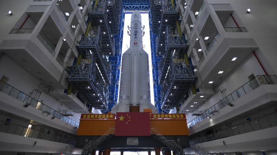 FILE - In this July 17, 2020, photo released by China's Xinhua News Agency, a Long March-5 rocket is seen at the Wenchang Space Launch Center in southern China's Hainan Province. Chinese technicians were making final preparations Monday, Nov. 23, 2020, to launch a Long March-5 rocket carrying a mission to bring back material from the lunar surface in a potentially major advance for the country's space program. (Zhang Gaoxiang/Xinhua via AP, File)