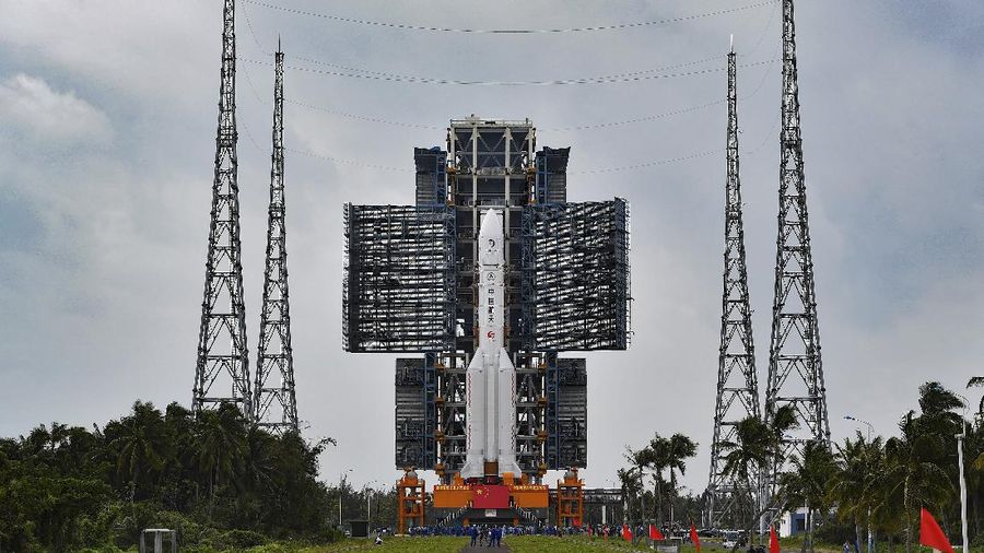 FILE - In this July 17, 2020, photo released by China's Xinhua News Agency, a Long March-5 rocket is seen at the Wenchang Space Launch Center in southern China's Hainan Province. Chinese technicians were making final preparations Monday, Nov. 23, 2020, to launch a Long March-5 rocket carrying a mission to bring back material from the lunar surface in a potentially major advance for the country's space program. (Zhang Gaoxiang/Xinhua via AP, File)