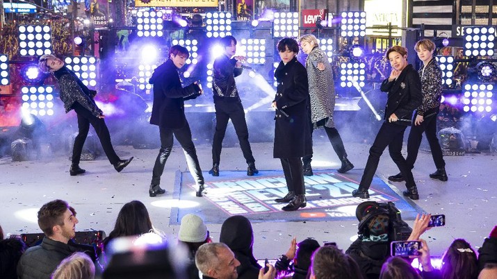 FILE - Members of BTS perform at the Times Square New Year's Eve celebration in New York on Dec. 31, 2019. The K-pop band is nominated for a Grammy Award for best pop duo/group performance with “Dynamite,