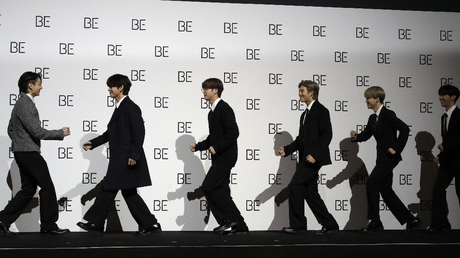 Members of South Korean K-pop band BTS arrive for a press conference to introduce their new album 