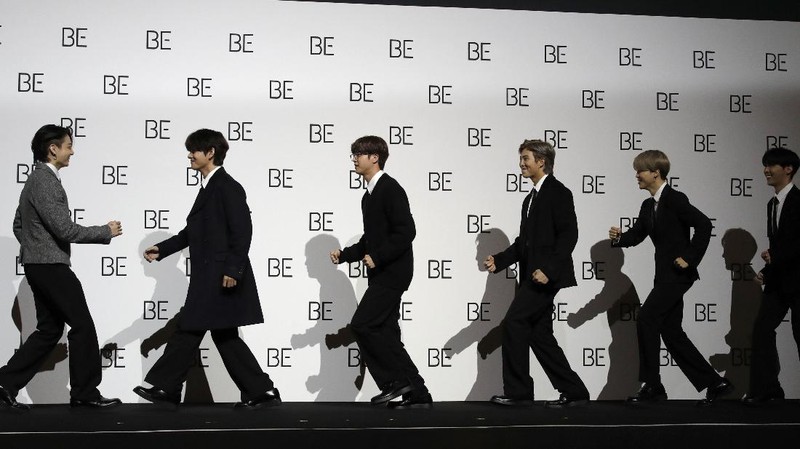 FILE - Members of BTS perform at the Times Square New Year's Eve celebration in New York on Dec. 31, 2019. The K-pop band is nominated for a Grammy Award for best pop duo/group performance with “Dynamite,