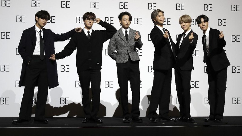 FILE - Members of BTS perform at the Times Square New Year's Eve celebration in New York on Dec. 31, 2019. The K-pop band is nominated for a Grammy Award for best pop duo/group performance with “Dynamite,