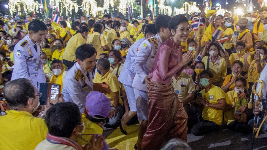Thailand's royal noble consort Sineenat Bilaskalayani greets supporters in Bangkok, Thailand, Sunday, Nov. 1, 2020. Under increasing pressure from protesters demanding reforms to the monarchy, Thailand's king and royal family met Sunday with thousands of adoring supporters in Bangkok, mixing with citizens in the street after attending a religious ceremony inside the Grand Palace. (AP Photo/Wason Wanichakorn)