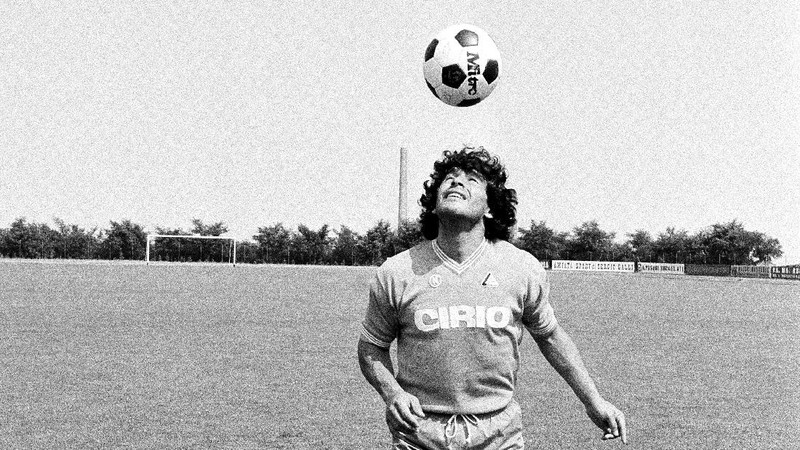 FILE - In this June 29, 1982 file photo, Diego Maradona is tackled by Italy's Claudio Gentile during a World Cup second-round match between Italy and Argentina at Sarra Stadium in Barcelona, Spain. The Argentine soccer great who was among the best players ever and who led his country to the 1986 World Cup title before later struggling with cocaine use and obesity, died from a heart attack on Wednesday, Nov. 25, 2020, at his home in Buenos Aires. He was 60. (AP Photo, File)