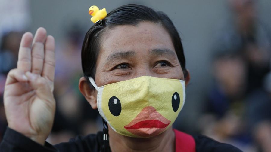 A crowd of protesters march in Bangkok, Thailand, Saturday, Nov. 28, 2020. Pro-democracy demonstrators are continuing their protests calling for the government to step down and reforms to the constitution and the monarchy, despite legal charges being filed against them and the possibility of violence from their opponents or a military crackdown. (AP Photo/Sakchai Lalit)