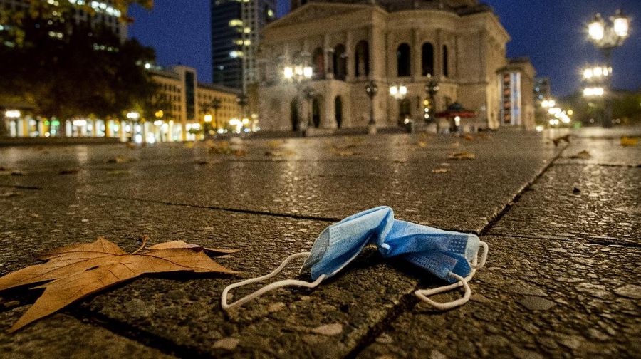 A face mask was left behind on the square in front of the Old Opera in Frankfurt, Germany, early Sunday, Nov. 22, 2020. (AP Photo/Michael Probst)