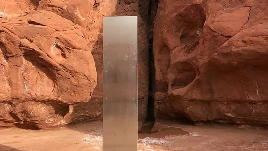 FILE - This Nov. 18, 2020, file photo provided by the Utah Department of Public Safety shows a metal monolith in the ground in a remote area of red rock in Utah. The mysterious silver monolith that was placed in the Utah desert has disappeared less than 10 days after it was spotted by wildlife biologists performing a helicopter survey of bighorn sheep, federal officials and witnesses said. The Bureau of Land Management said it had received credible reports that the three-sided stainless steel structure was removed on Nov. 27.  (Utah Department of Public Safety via AP, File)