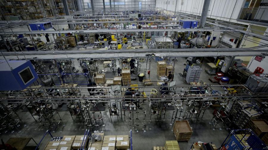 The interior of the Brompton folding bicycles factory in west London, is seen from a mezzanine, Tuesday, Nov. 24, 2020. The team at Brompton Bicycles company thought they were prepared for Britain's Brexit split with Europe, but they face uncertainty about supplies and unexpected new competition from China, all amid a global COVID pandemic. (AP Photo/Matt Dunham)