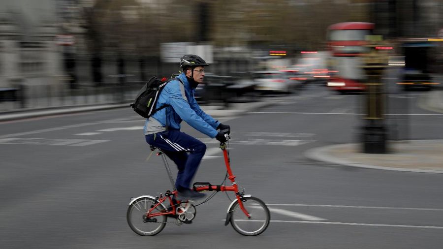 Brompton folding bicycles are assembled by hand at the Brompton factory in west London, Tuesday, Nov. 24, 2020.  The team at Brompton Bicycles company thought they were prepared for Britain's Brexit split with Europe, but they face uncertainty about supplies and unexpected new competition from China, all amid a global COVID pandemic.(AP Photo/Matt Dunham)