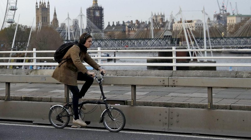 Brompton folding bicycles are assembled by hand at the Brompton factory in west London, Tuesday, Nov. 24, 2020.  The team at Brompton Bicycles company thought they were prepared for Britain's Brexit split with Europe, but they face uncertainty about supplies and unexpected new competition from China, all amid a global COVID pandemic.(AP Photo/Matt Dunham)