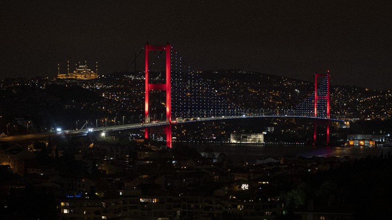 People walk in Istanbul, backdropped by the Galata Tower, during a curfew Tuesday, Dec. 1, 2020, part of the new measures to try curb the spread of the coronavirus. Turkey had gone into the most widespread lockdown so far amid a surge in COVID-19 infections, extending curfews to weeknights and full lockdowns over weekends. The curfew would be implemented on weekdays between 9:00 pm and 5:00 am. He also announced total weekend lockdowns from 9:00 pm on Friday evenings to 5:00 am Monday. (AP Photo)