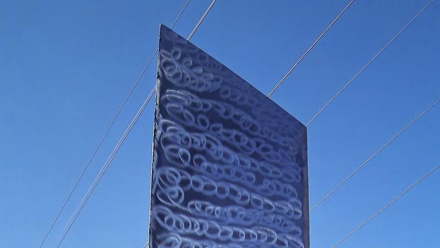 A metal structure sticks from the ground on the Batca Doamnei hill, outside Piatra Neamt, northern Romania, on Nov. 27, 2020. The structure, similar in shape and size to the monolith that was placed in the Utah desert, has since disappeared.(Robert Iosub/ziarpiatraneamt.ro via AP)