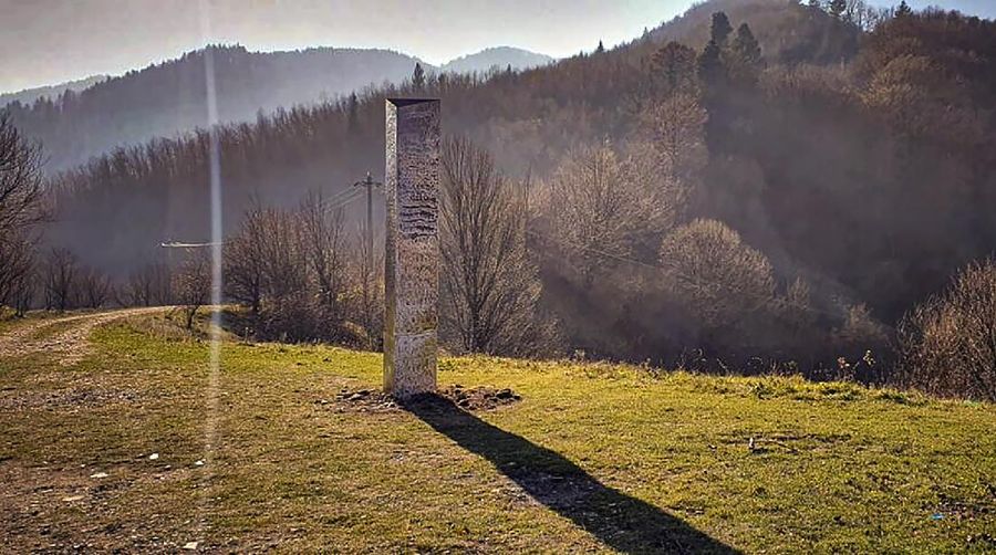 A metal structure sticks from the ground on the Batca Doamnei hill, outside Piatra Neamt, northern Romania, on Nov. 27, 2020. The structure, similar in shape and size to the monolith that was placed in the Utah desert, has since disappeared.(Robert Iosub/ziarpiatraneamt.ro via AP)