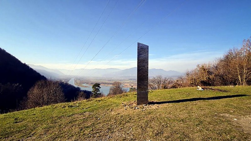 A metal structure sticks from the ground on the Batca Doamnei hill, outside Piatra Neamt, northern Romania, on Nov. 27, 2020. The structure, similar in shape and size to the monolith that was placed in the Utah desert, has since disappeared.(Robert Iosub/ziarpiatraneamt.ro via AP)