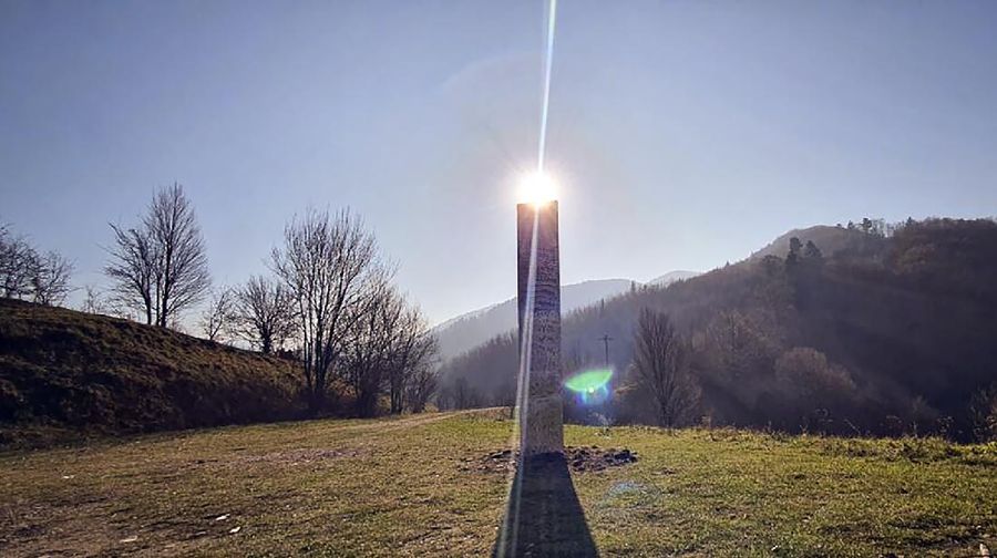 A metal structure sticks from the ground on the Batca Doamnei hill, outside Piatra Neamt, northern Romania, on Nov. 27, 2020. The structure, similar in shape and size to the monolith that was placed in the Utah desert, has since disappeared.(Robert Iosub/ziarpiatraneamt.ro via AP)