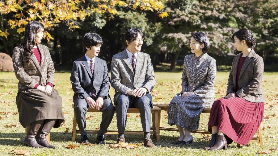 In this photo provided by the Imperial Household Agency of Japan,  Japan's Crown Prince Akishino, center, talks with his wife Crown Princess Kiko, second right, and their children, Princess Mako, left, Princess Kako and Prince Hisahito at their residence in Tokyo on Nov. 14, 2020. Akishino celebrates his 55th birthday Monday, Nov. 30. 2020. (Imperial Household Agency of Japan via AP)