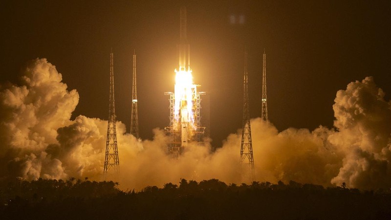 A Long March-5 rocket carrying the Chang'e 5 lunar mission lifts off at the Wenchang Space Launch Center in Wenchang in southern China's Hainan province, early Tuesday, Nov. 24, 2020. China's trip to the moon and, presumably, back is the latest milestone in the Asian powerhouse's slow but steady ascent to the stars. (AP Photo/Mark Schiefelbein, File)