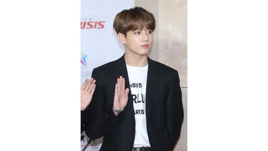 In this Nov. 28, 2018, photo, a member of K-pop group BTS, Jungkook, poses for the media at the Asia Artist Awards in Incheon, South Korea. Police say they are investigating Jungkook over a traffic accident on Saturday, Nov. 2, 2019, involving the band member and a taxi driver. (Cho Su-jeung/Newsis via AP)
