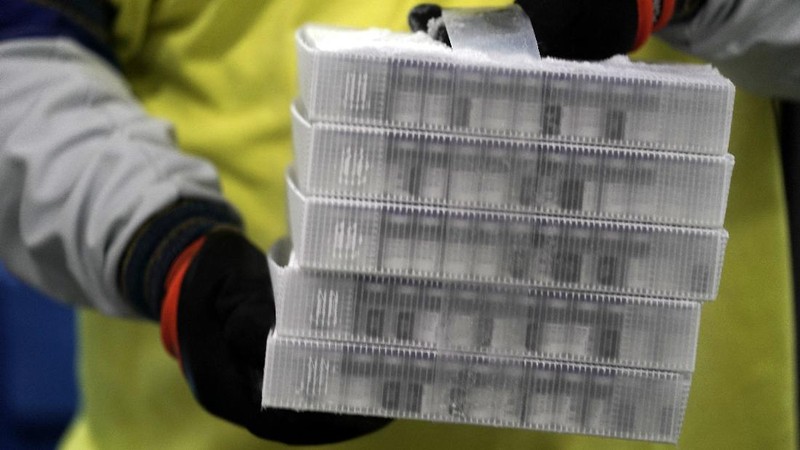 The first shipment of Pfizer-BioNTech COVID-19 vaccines are loaded onto a UPS jet Sunday, Dec. 13, 2020, at Michigan's UPS hub at Capital Region International Airport in Lansing, Mich. (Matthew Dae Smith/Lansing State Journal via AP)