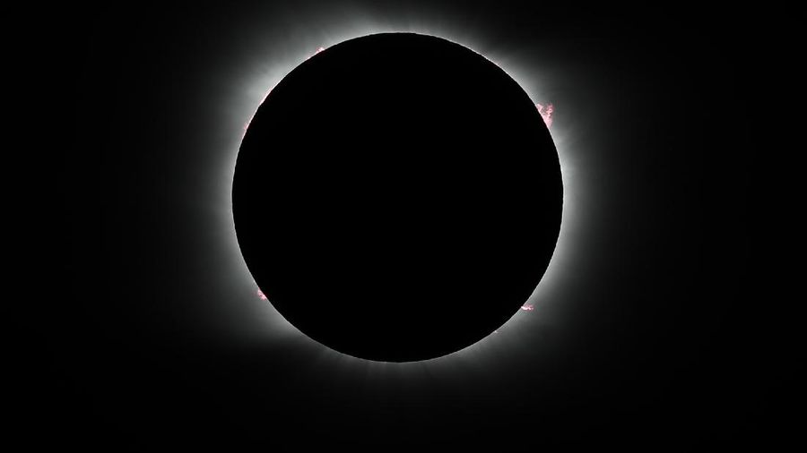 The moon covers the sun during a solar eclipse in Piedra del Aguila, Argentina, Monday, Dec. 14, 2020. The total solar eclipse was visible from the northern Patagonia region of Argentina and from Araucania in Chile. (AP Photo/Natacha Pisarenko)