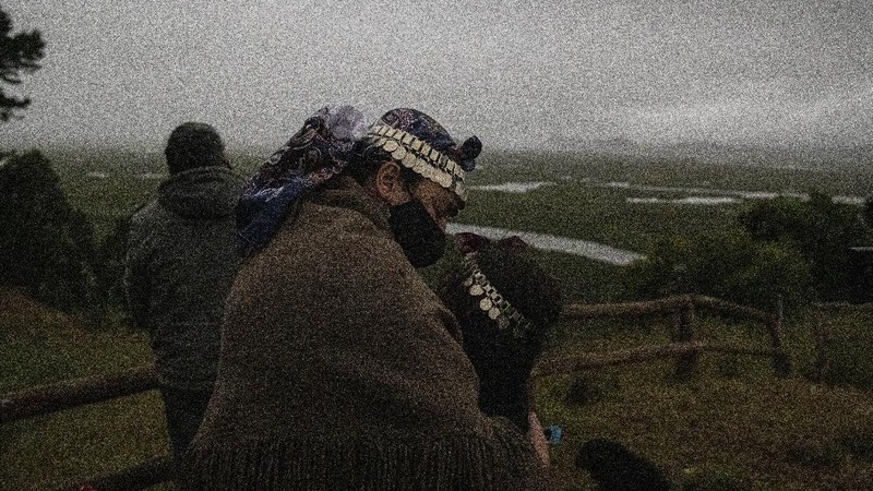 People walk on a dune, a day before a total eclipse in Nahuelpan, La Araucania, Chile,Sunday, Dec. 13, 2020. The total eclipse will be visible from Chile and the northern Patagonia region of Argentina, and as a partial solar eclipse in Bolivia, Brazil, Ecuador, Paraguay, Peru and Uruguay. (AP Photo/Esteban Felix)