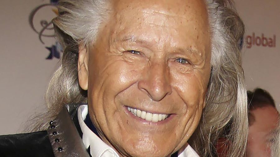 FILE - In this March 2, 2014, file photo, Peter Nygard attends the 24th Night of 100 Stars Oscars Viewing Gala at The Beverly Hills Hotel in Beverly Hills, Calif. Nygard faces criminal charges in New York after his Canadian arrest on charges alleging that he dangled opportunities in fashion and modeling to lure dozens of women and girls to have sex with himself and others. The 79-year-old Nygard awaited an appearance in a Winnipeg courtroom after his Monday, Dec. 14, 2020 arrest in Winnipeg, Manitoba, Canada by Canadian authorities at the request of the United States. (Annie I. Bang /Invision/AP, File)