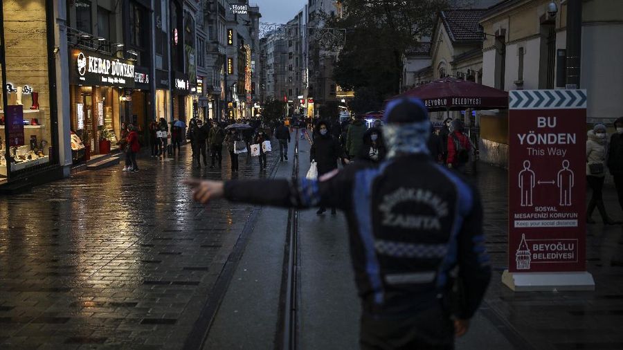The square in front of the Brandenburg Gate is deserted in Berlin, Germany, early Wednesday, Dec. 16, 2020. In all of Germany, the hard lockdown has begun to slow down the spread of the coronavirus. (Paul Zinken/dpa via AP)