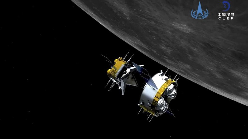 In this photo released by Xinhua News Agency, recovery crew members check on the capsule of the Chang'e 5 probe after its successful landed in Siziwang district, north China's Inner Mongolia Autonomous Region on Thursday, Dec. 17, 2020. A Chinese lunar capsule returned to Earth on Thursday with the first fresh samples of rock and debris from the moon in more than 40 years. (Ren Junchuan/Xinhua via AP)