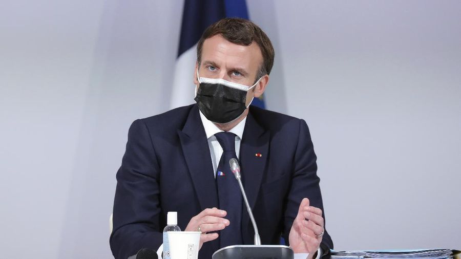 France's President Emmanuel Macron delivers a speech during a Citizens' Convention on Climate, in Paris, Monday, Dec. 14. (AP Photo/Thibault Camus, Pool)
