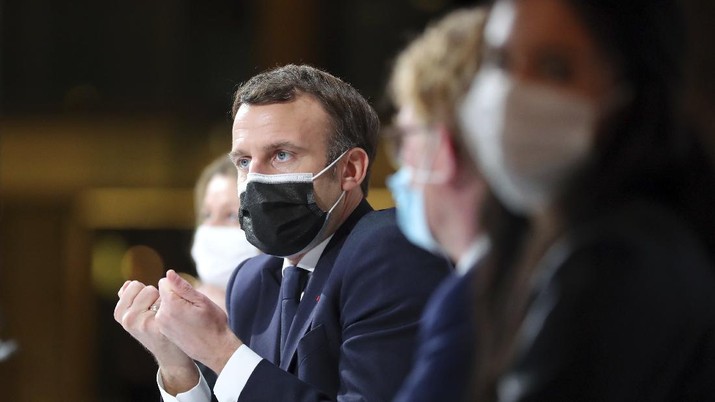 France's President Emmanuel Macron delivers a speech during a Citizens' Convention on Climate, in Paris, Monday, Dec. 14. (AP Photo/Thibault Camus, Pool)