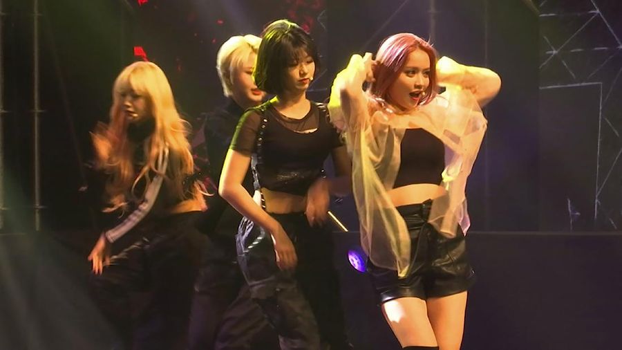 In this image made from a video, former and current members of K-pop band 