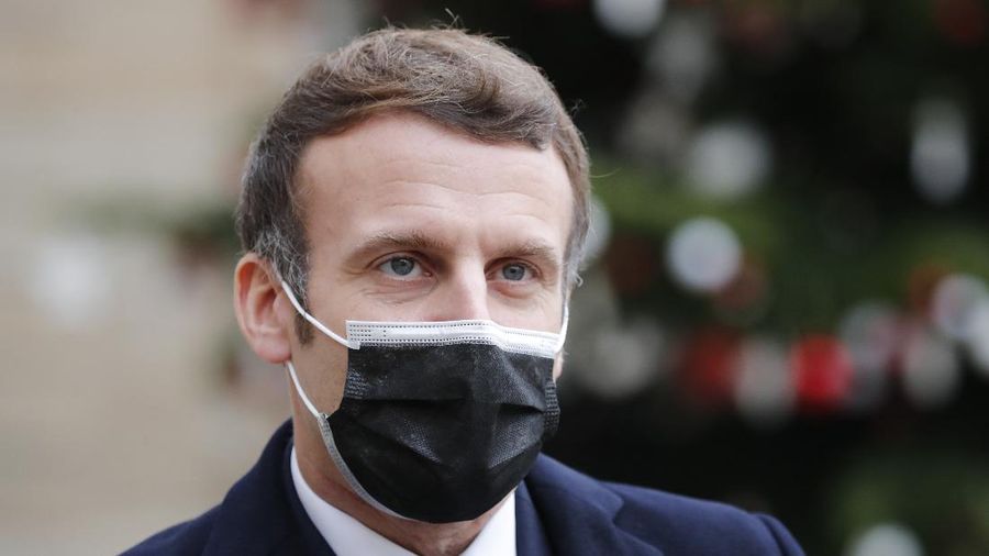 French President Emmanuel Macron reacts as he meets Portuguese Prime Minister Antonio Costa, Wednesday, Dec. 16, 2020 in Paris. French President Emmanuel Macron has tested positive for COVID-19, the presidential Elysee Palace announced on Thursday. (AP Photo/Francois Mori)