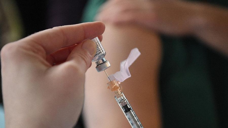 System Pharmacy Clinical Manager at Hartford HealthCare Colleen Teevan prepares the Pfizer-BioNTech vaccine for COVID-19 to give to a front line worker outside of Hartford Hospital, Monday, Dec. 14, 2020, in Hartford, Conn. (AP Photo/Jessica Hill)
