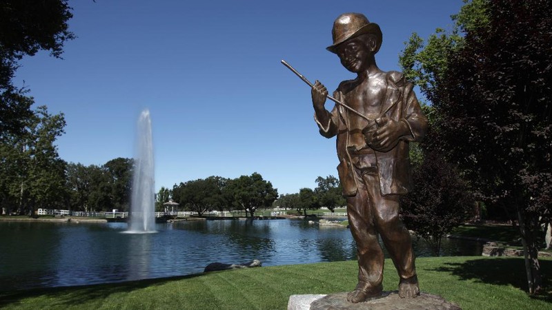 FILE - This Dec. 17, 2004, file photo shows the rear entrance to pop star Michael Jackson's Neverland Ranch home in Santa Ynez, Calif. Jackson’s Neverland Ranch has found a new owner in billionaire businessman Ron Burkle.  Burkle’s spokesman said in an email Thursday, Dec. 24, 2020, that Burkle bought the 2,700-acre property near Santa Barbara, California. (AP Photo/Mark J. Terrill, file)