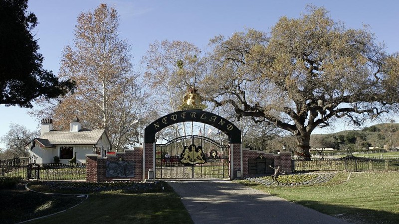 FILE - This Dec. 17, 2004, file photo shows the rear entrance to pop star Michael Jackson's Neverland Ranch home in Santa Ynez, Calif. Jackson’s Neverland Ranch has found a new owner in billionaire businessman Ron Burkle.  Burkle’s spokesman said in an email Thursday, Dec. 24, 2020, that Burkle bought the 2,700-acre property near Santa Barbara, California. (AP Photo/Mark J. Terrill, file)