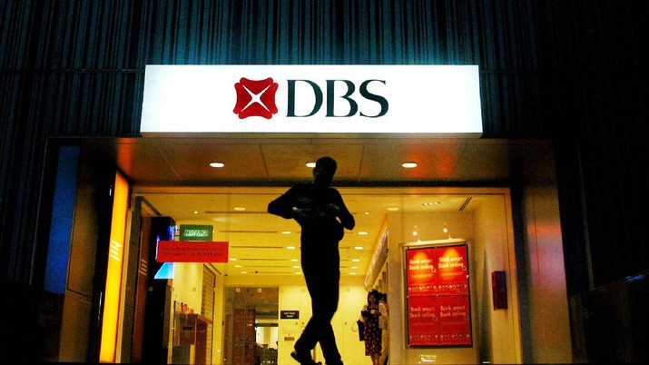 A man is silhouetted against a DBS Bank in Singapore late Thursday, Oct. 28, 2004. Southeast Asia's largest bank, DBS Bank, announced Friday its group's third-quarter net profit rose 24 percent on year, boosted by higher income and lower provisions. (AP Photo/Wong Maye-e)
