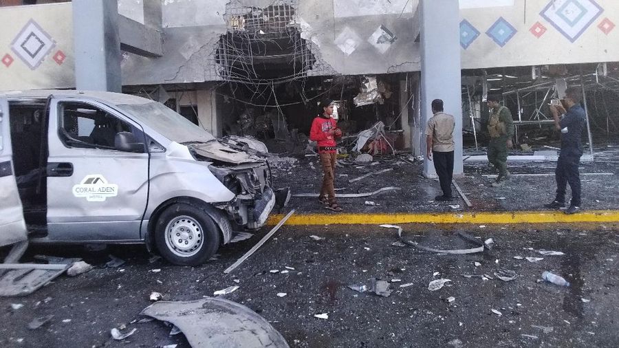 People run following an explosion at the airport in Aden, Yemen, shortly after a plane carrying the newly formed Cabinet landed on Wednesday, Dec. 30, 2020. No one on board the government plane was hurt but initial reports said several people at the airport were killed. (AP Photo)