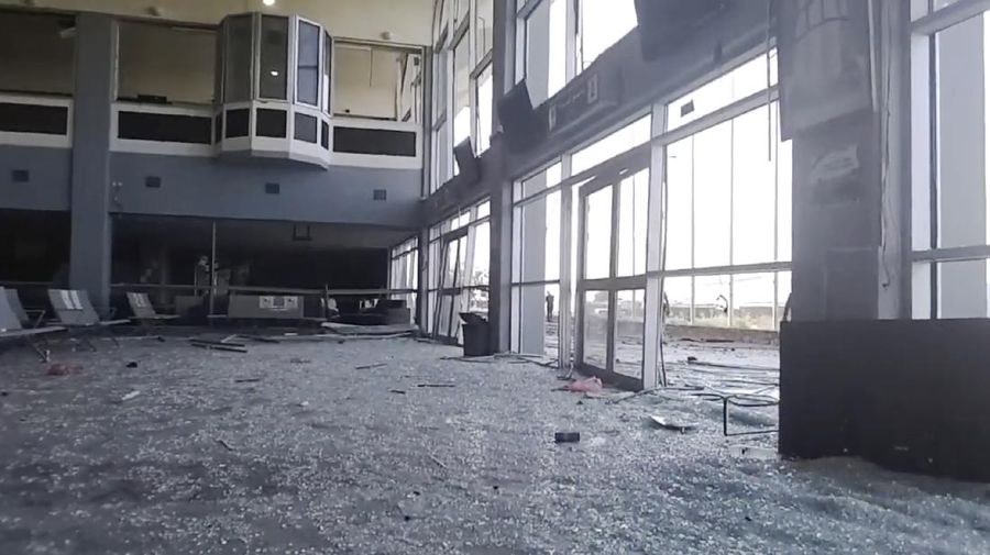 People run following an explosion at the airport in Aden, Yemen, shortly after a plane carrying the newly formed Cabinet landed on Wednesday, Dec. 30, 2020. No one on board the government plane was hurt but initial reports said several people at the airport were killed. (AP Photo)