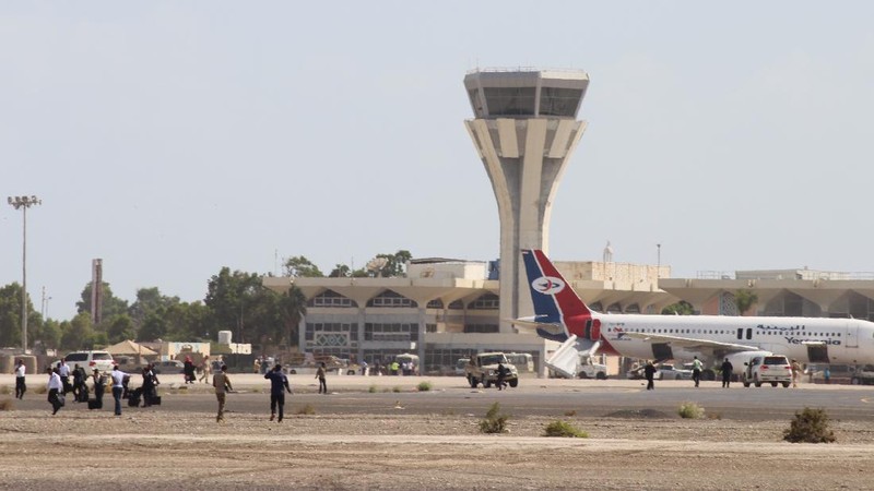 People run following an explosion at the airport in Aden, Yemen, shortly after a plane carrying the newly formed Cabinet landed on Wednesday, Dec. 30, 2020. No one on board the government plane was hurt but initial reports said several people at the airport were killed. (AP Photo)