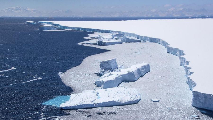 In this recent handout photo provided by the Ministry of Defense on Wednesday, Dec. 23, 2020 fragments break off from one of the largest recorded icebergs, called the A68a, floating near the island of South Georgia in the South Atlantic. (Corporal Phil Dye/Ministry of Defence via AP)