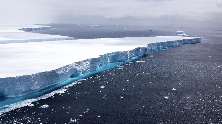 In this recent handout photo provided by the Ministry of Defense on Wednesday, Dec. 23, 2020 fragments break off from one of the largest recorded icebergs, called the A68a, floating near the island of South Georgia in the South Atlantic. (Corporal Phil Dye/Ministry of Defence via AP)