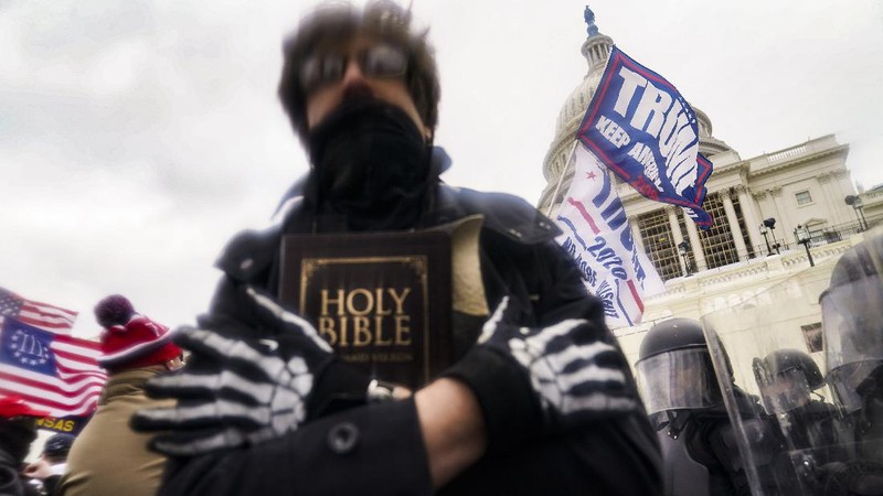 With the Washington Monument in the background, people attend a rally in support of President Donald Trump on Wednesday, Jan. 6, 2021, in Washington. (AP Photo/Jose Luis Magana)