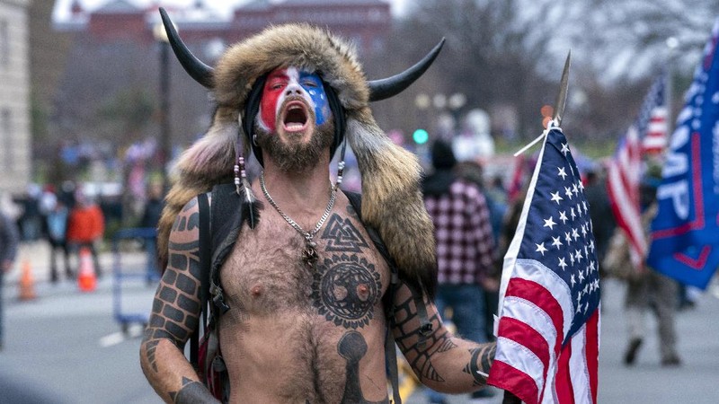 With the Washington Monument in the background, people attend a rally in support of President Donald Trump on Wednesday, Jan. 6, 2021, in Washington. (AP Photo/Jose Luis Magana)