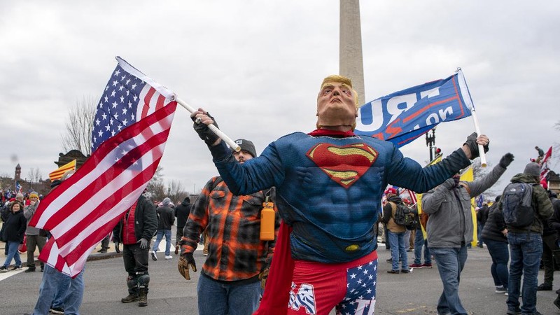 With the Washington Monument in the background, people attend a rally in support of President Donald Trump on Wednesday, Jan. 6, 2021, in Washington. (AP Photo/Jose Luis Magana)