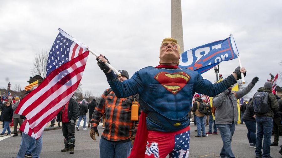 With the Washington Monument in the background, people attend a rally in support of President Donald Trump on Wednesday, Jan. 6, 2021, in Washington. (AP Photo/Jose Luis Magana)
