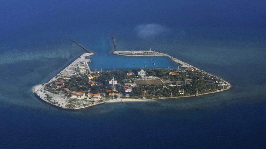 The Vietnamese-claimed Southwest Cay island in the Spratly island group is seen from a Philippine Air Force C-130 transport plane during the visit to the Philippine-claimed Thitu Island by Defense Secretary Delfin Lorenzana, Armed Forces Chief Gen. Eduardo Ano and other officials in disputed South China Sea, western Philippines, Friday, April 21, 2017. The South China Sea issue is expected to be discussed in the 20th ASEAN Summit of Leaders next week. (Francis Malasig, Pool Photo via AP)